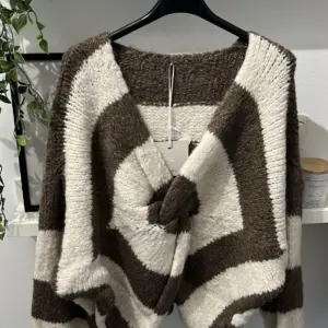 Knoten Pullover Schoko/Creme